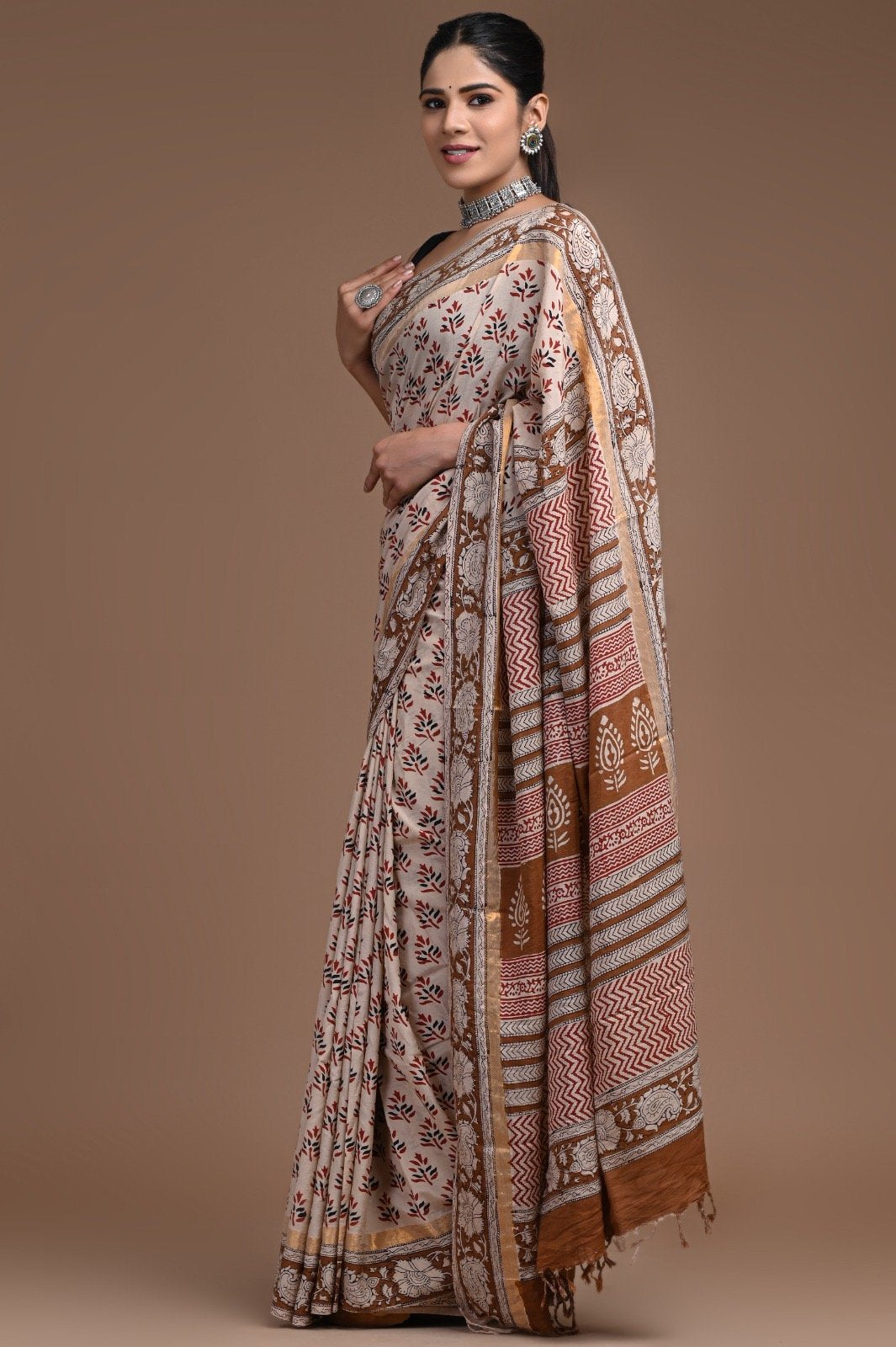 Ivory saree with brown floral and geometric hand block print motifs