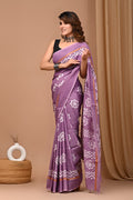 Purple saree with floral motifs and geometric border design