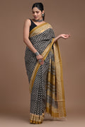 Black and mustard silk saree with buta motifs and intricate border design