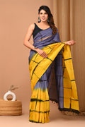 Blue and yellow saree with geometric block print design, rich festive aesthetic