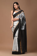 Black and white saree with geometric hand block print and gold border