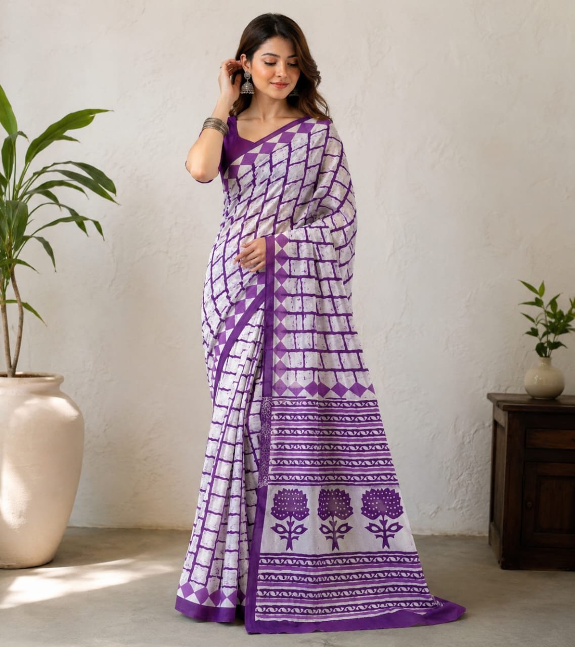 Purple saree with geometric patterns and floral motifs in Bagru print