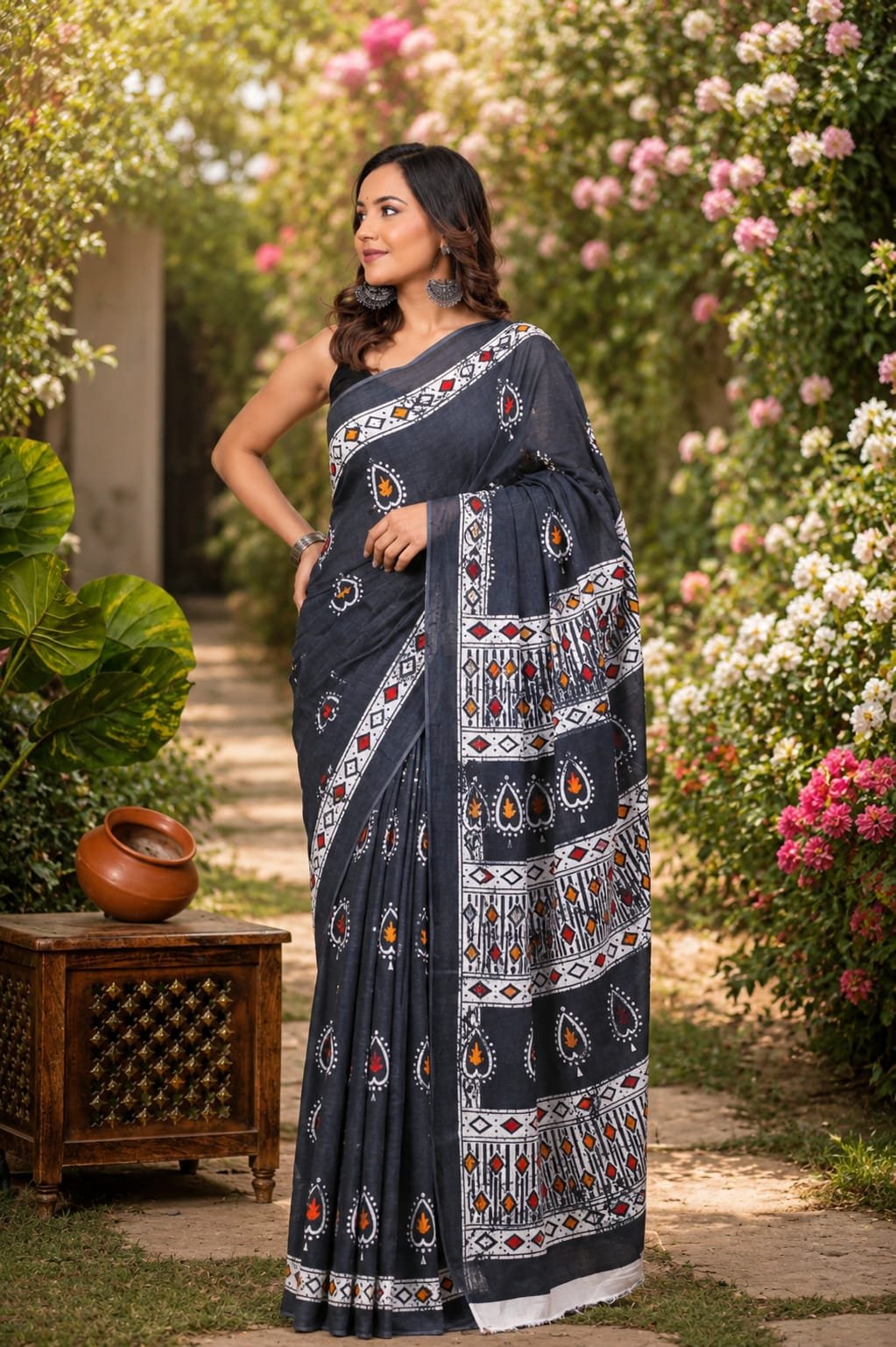 Dark indigo saree with floral and geometric motifs in natural dyes