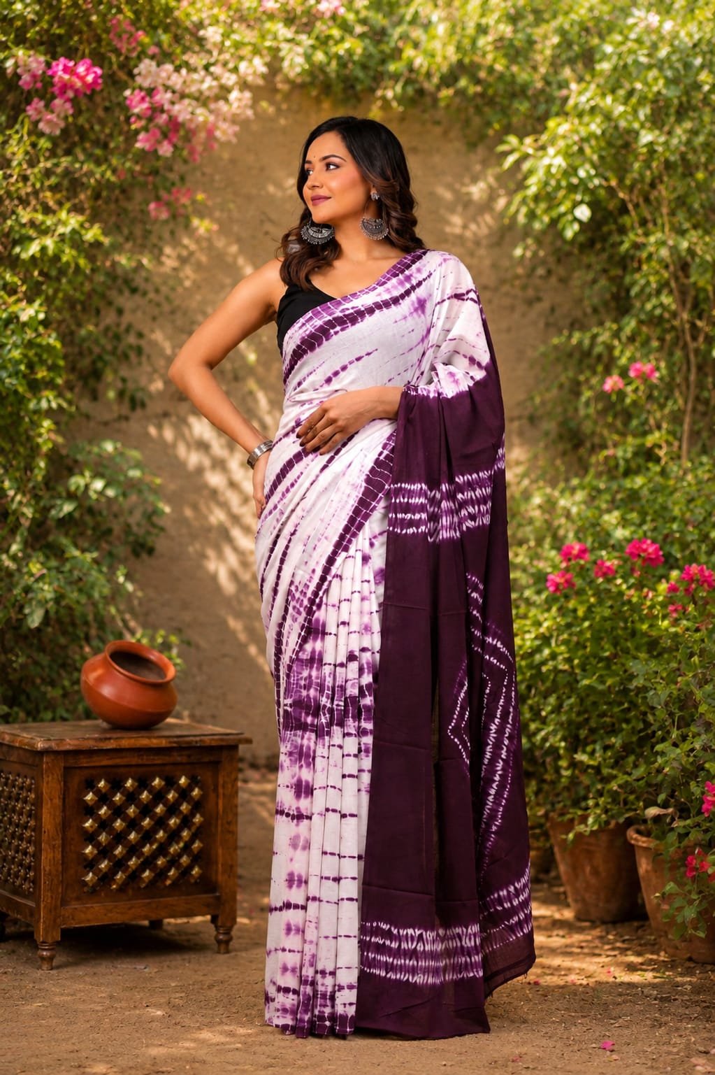 Purple and white tie-dye saree with intricate border design