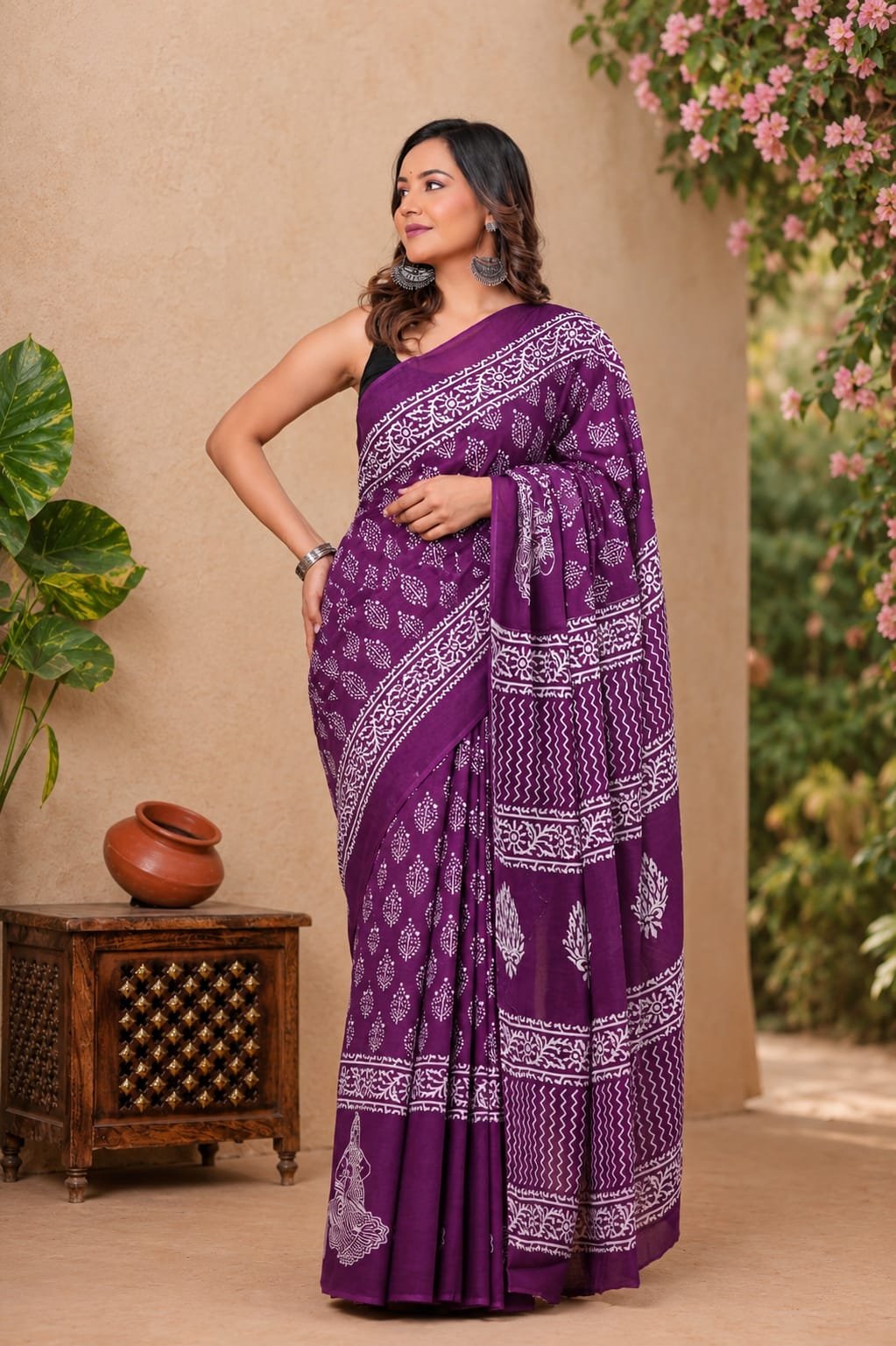 Purple saree with white floral motifs and geometric patterns