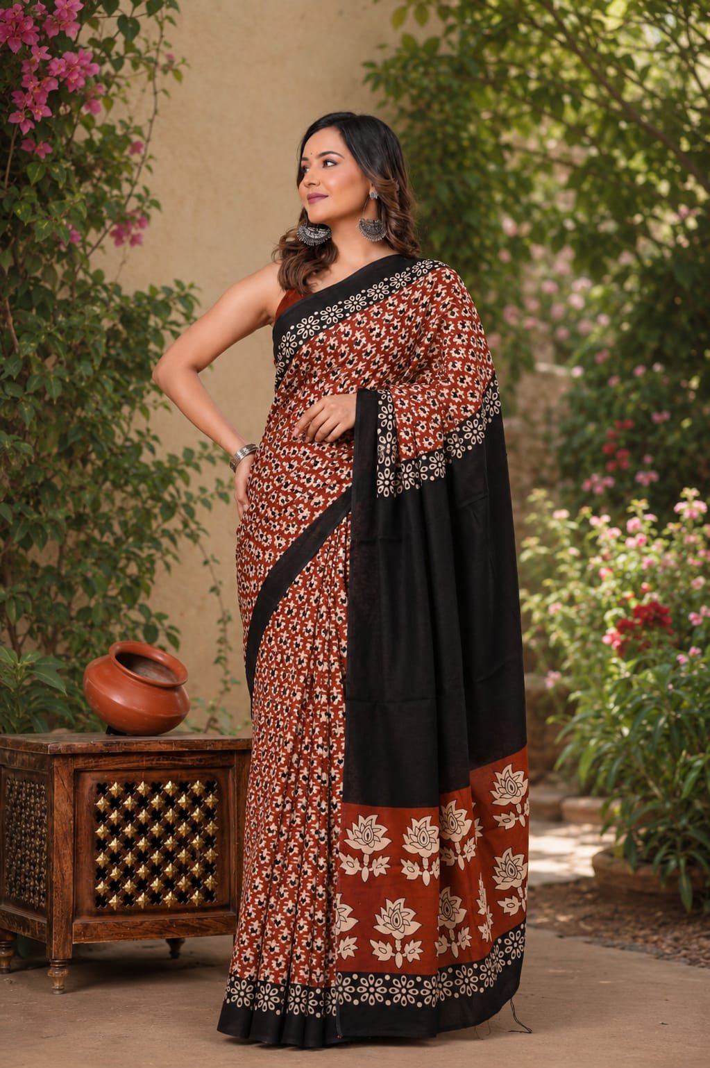 Rust and black floral Bagru hand block print saree with black border