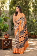 Orange and black saree with geometric and floral Bagru hand block print