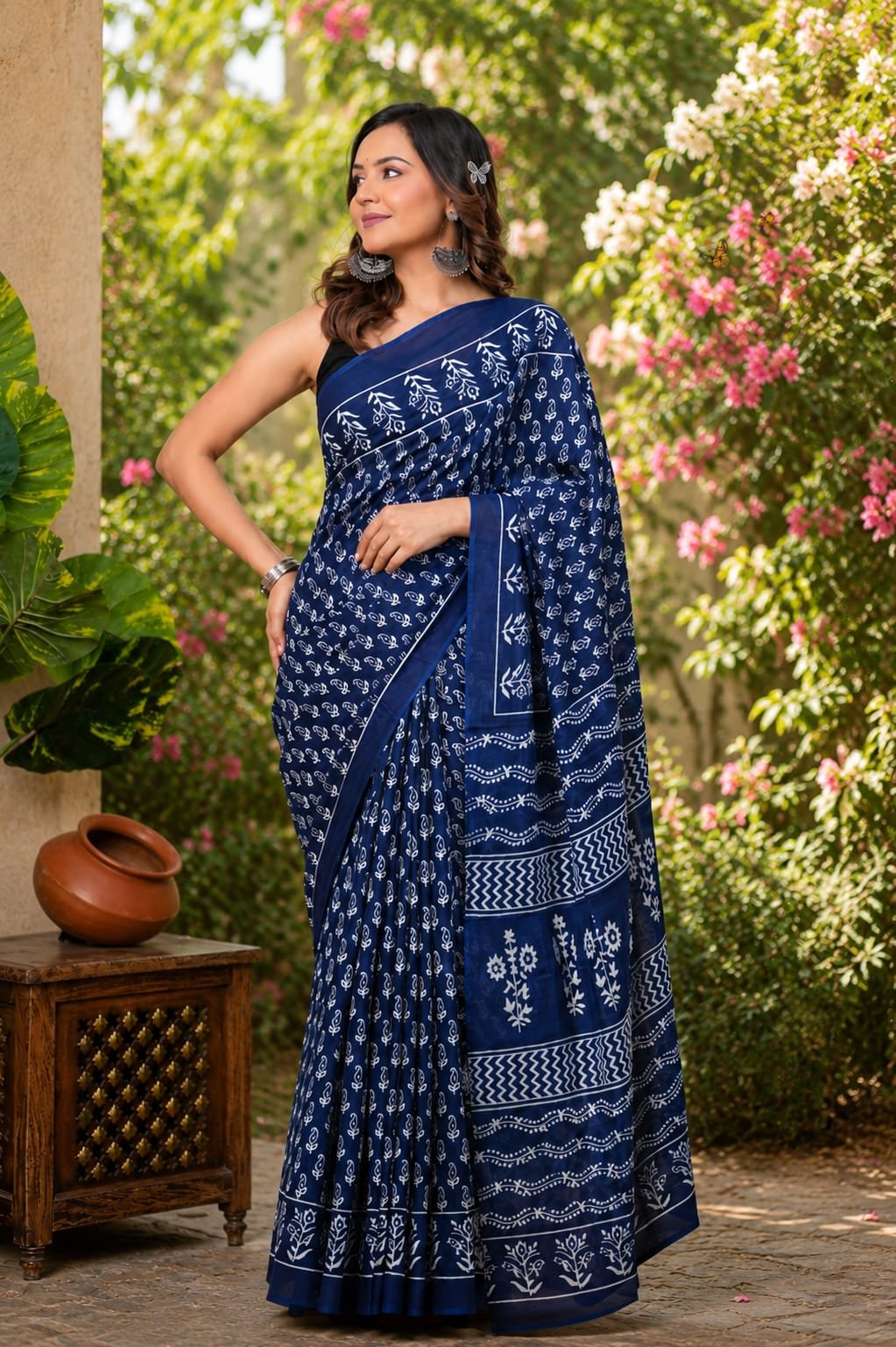 Navy blue saree with white floral motifs and traditional Bagru hand block print
