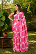Pink saree with geometric patterns in traditional Bagru hand block print
