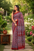 Red saree with blue floral motifs, traditional Bagru print