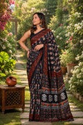 Black and red saree with floral and geometric motifs in Bagru hand block print