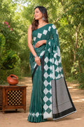Teal saree with geometric diamond patterns and striped border