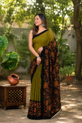 Olive green saree with floral motifs and black border, Bagru hand block print
