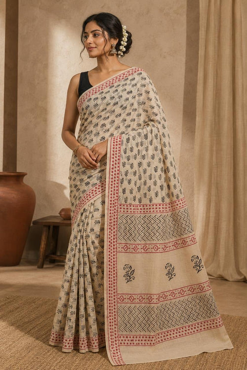 Beige saree with black floral motifs and red border, Bagru hand block printed