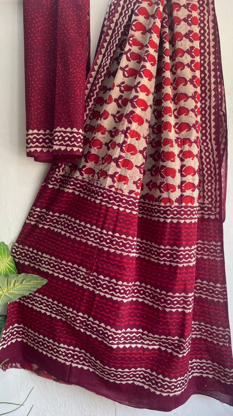 Red saree with geometric and floral Bagru hand block print motifs
