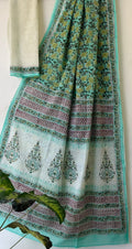 Aqua saree with floral motifs and intricate border design