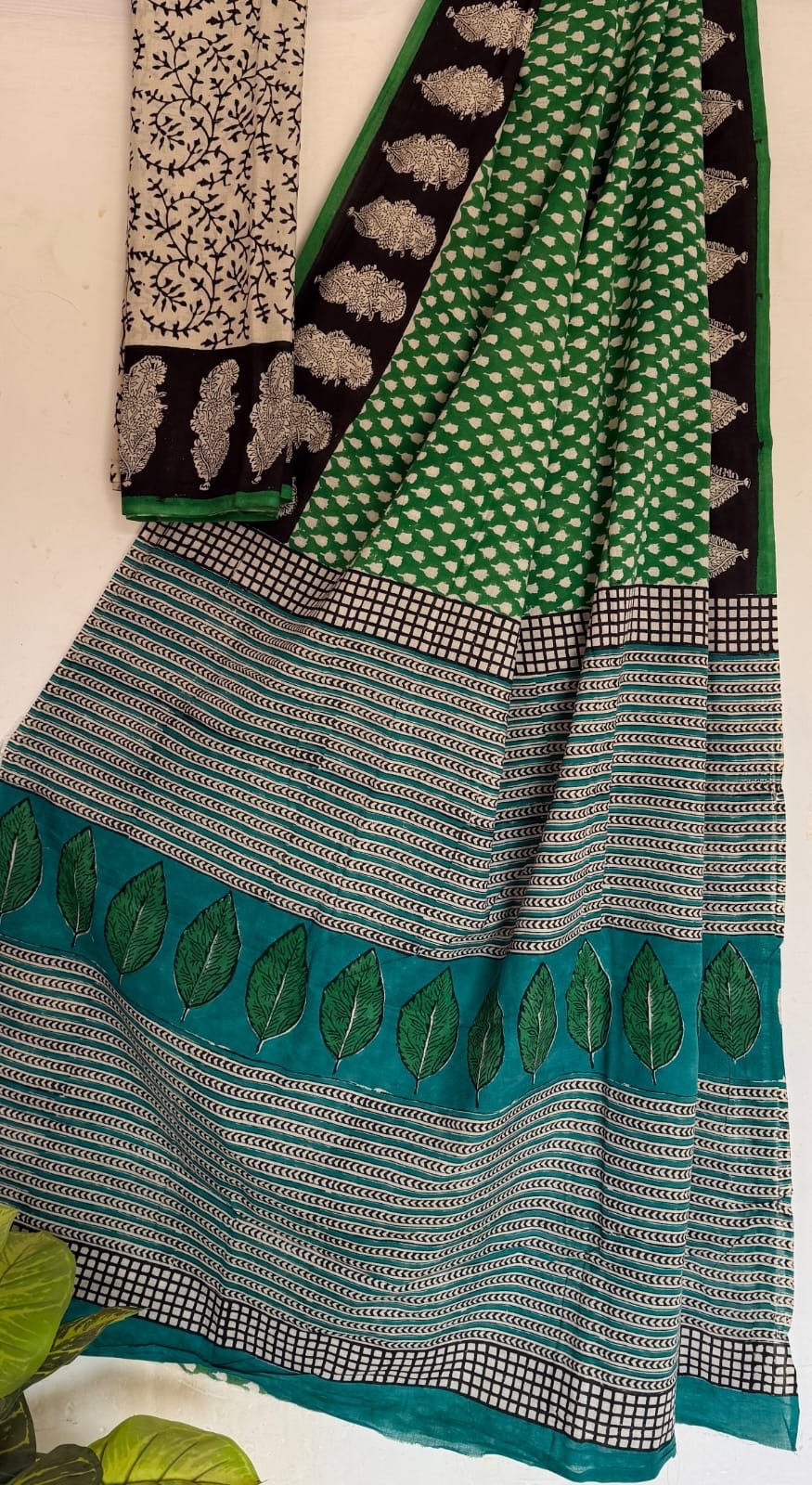Green saree with leaf and stripe motifs in Bagru hand block print