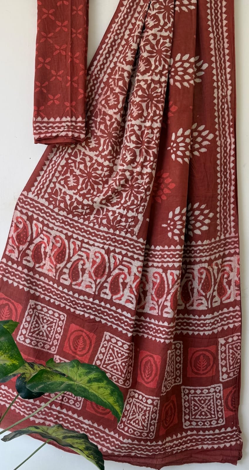 Rust saree with floral and geometric Bagru hand block print design