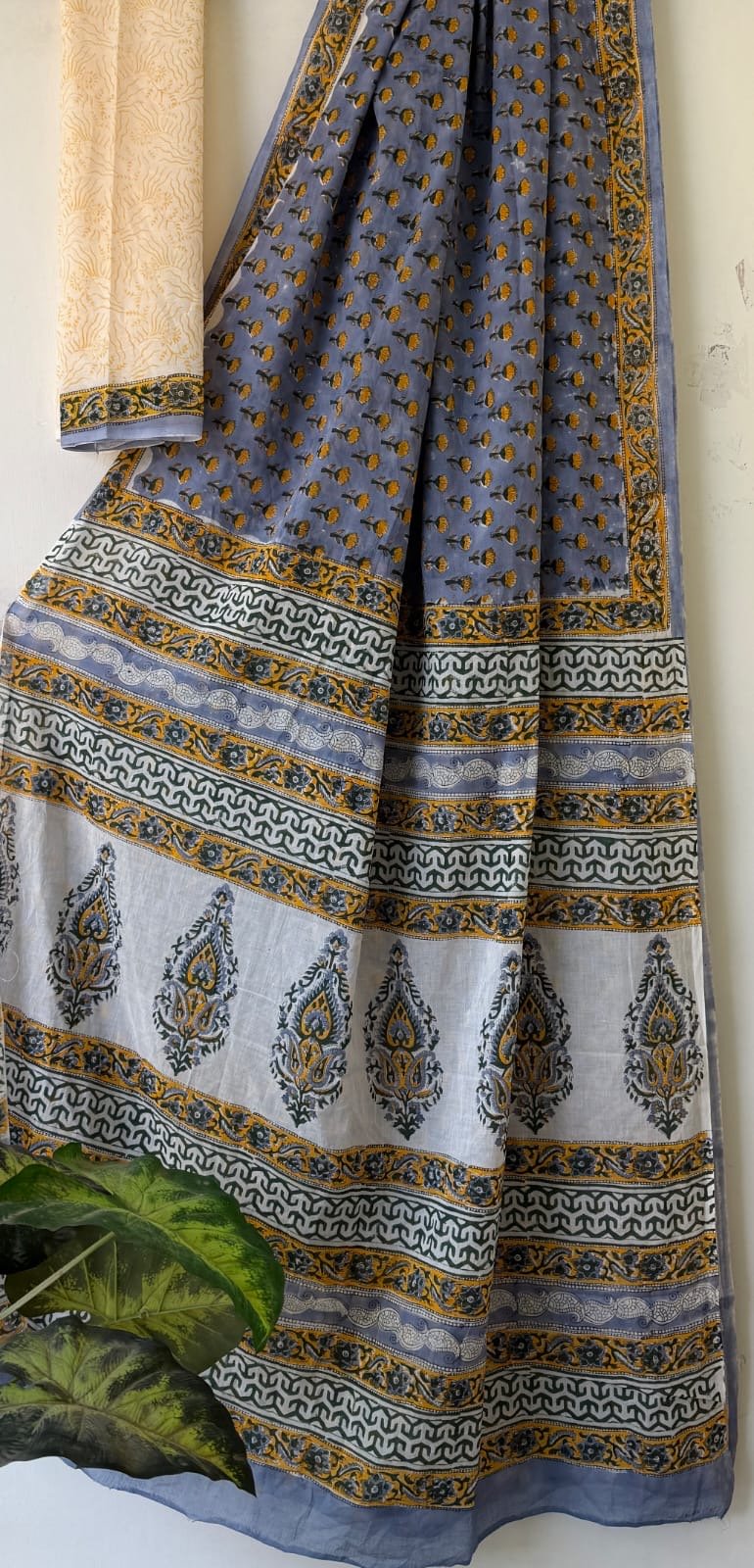 Blue saree with floral and paisley motifs in Bagru hand block print