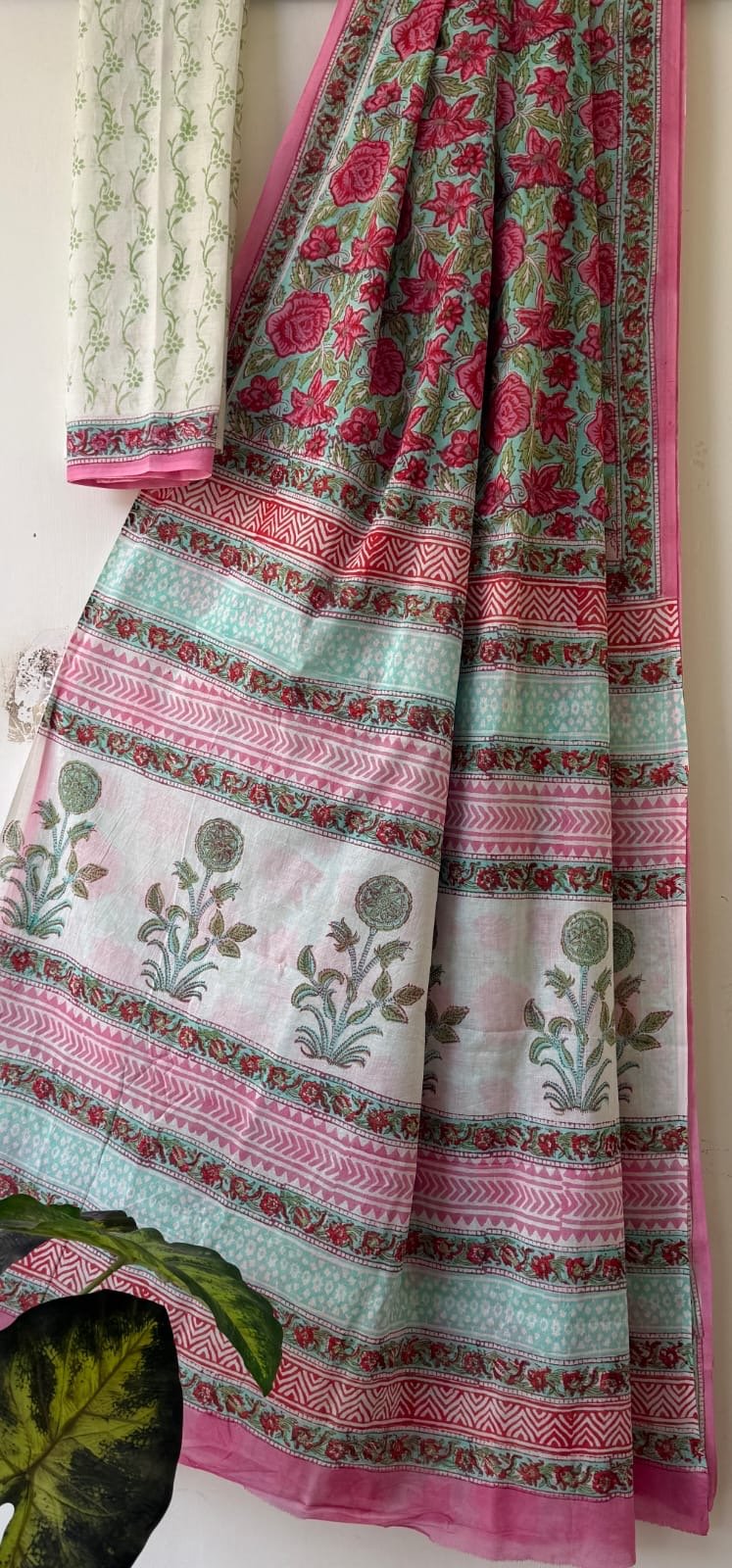 Pink and teal floral motifs with bold geometric border on Mul Cotton saree