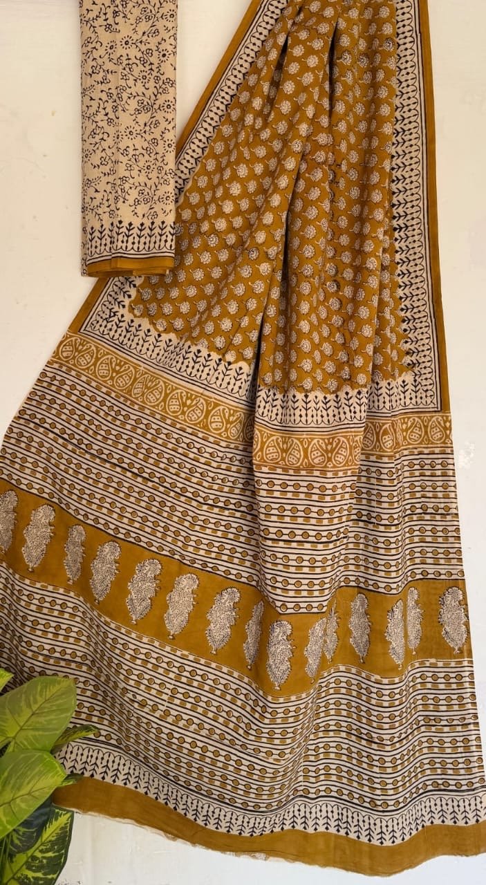 Mustard saree with floral buta motifs and Bagru block print