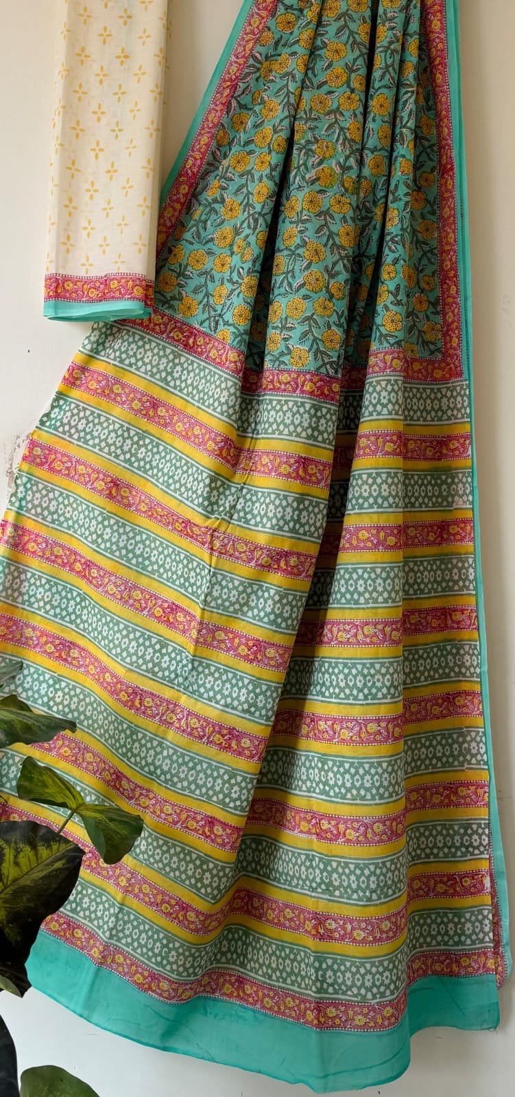 Turquoise saree featuring floral motifs and stripes in Bagru hand block print