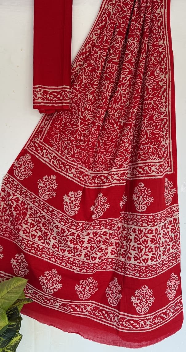 Red saree with white floral motifs and traditional Bagru block print