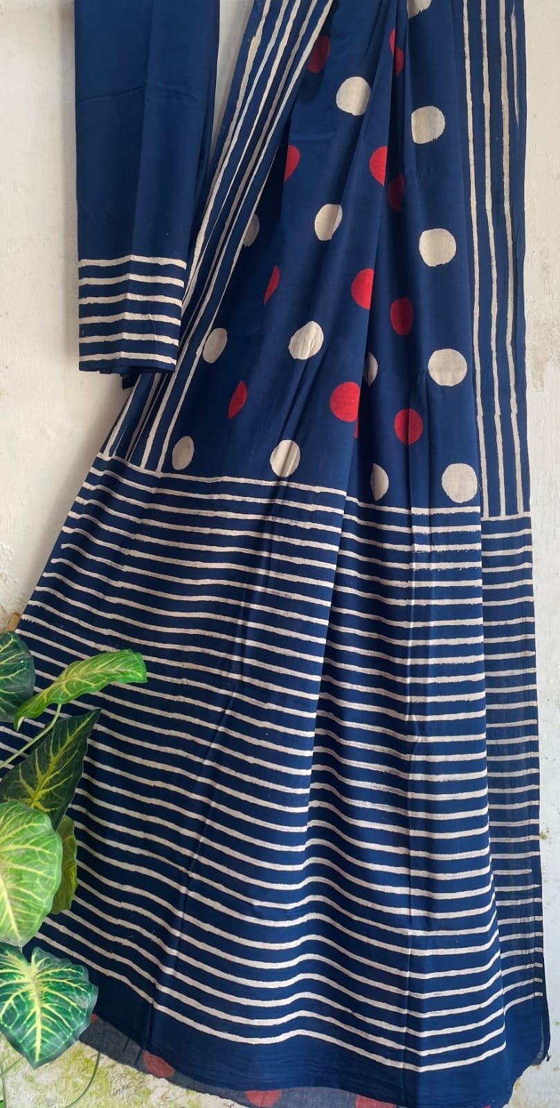 Navy blue saree with white and red polka dots and stripes pattern