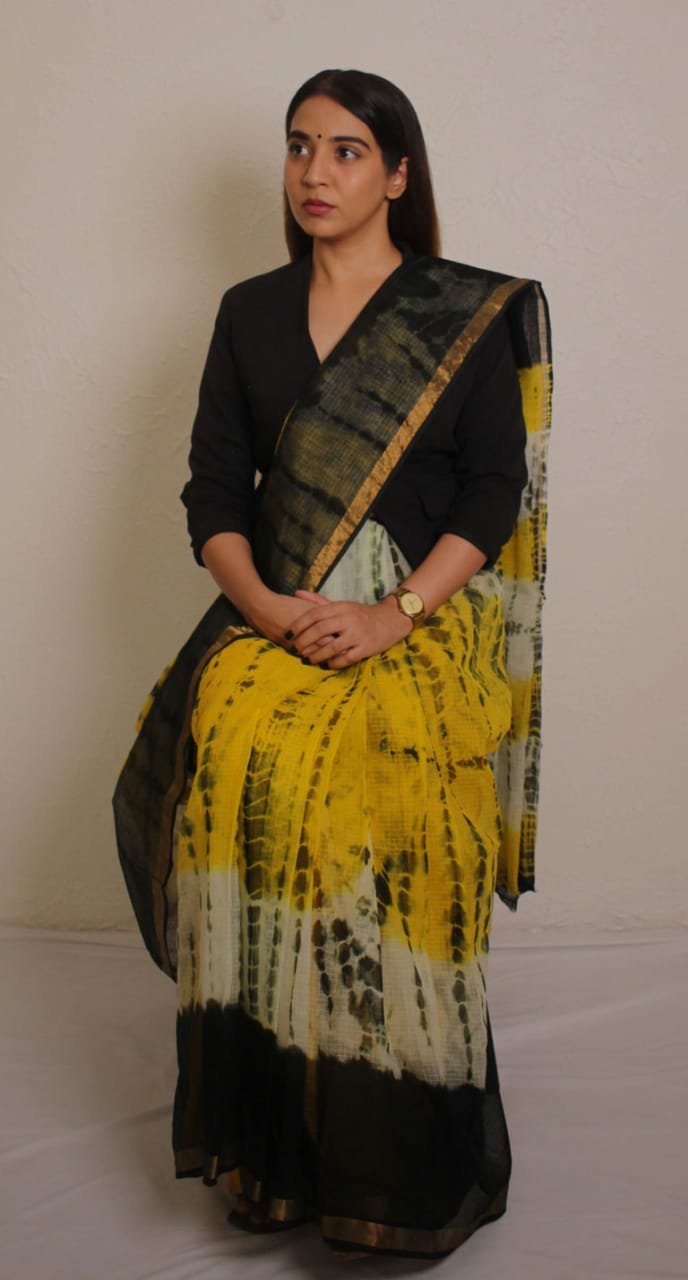 Yellow and black abstract saree with golden border and khat texture