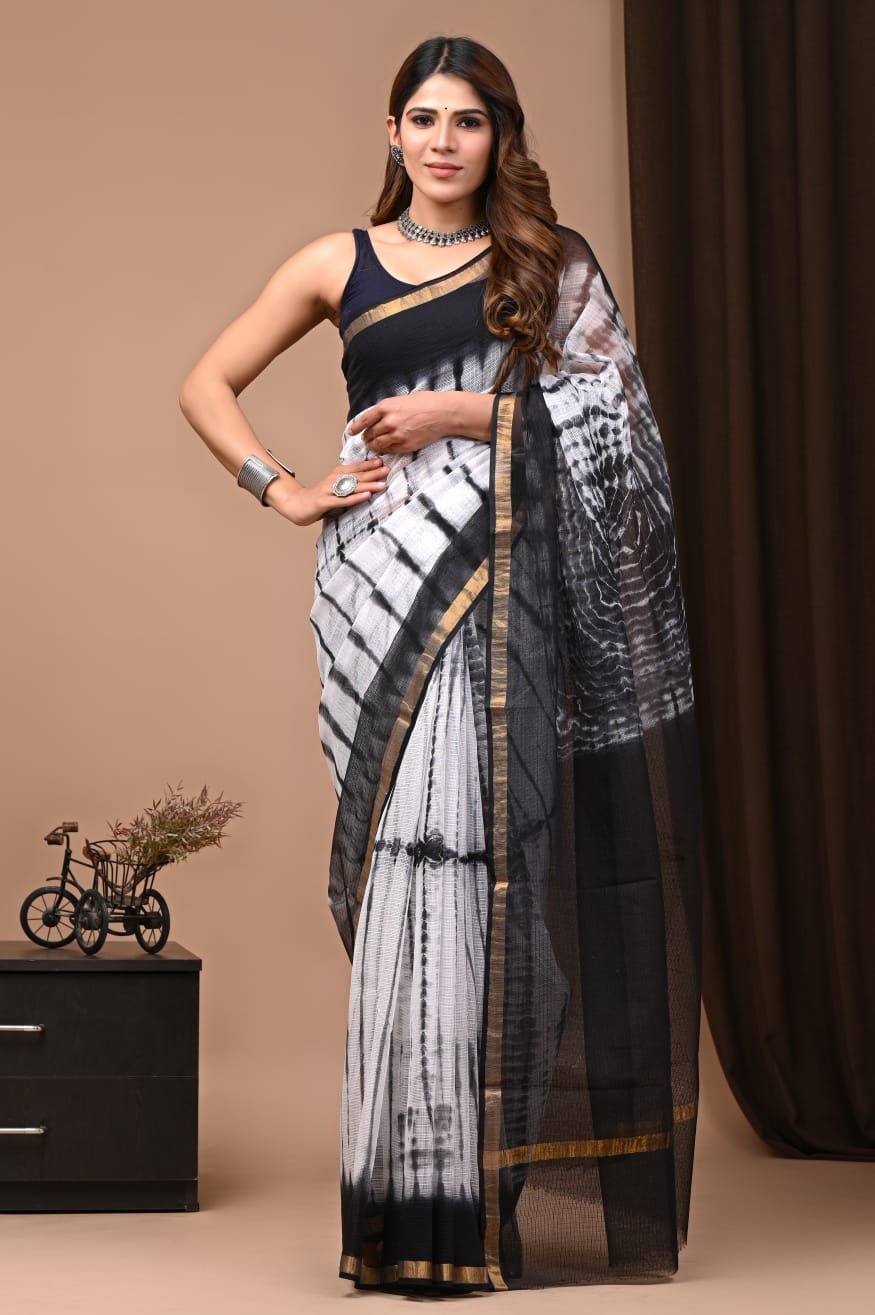 Black and white Kota Doriya saree with jaal pattern and tan border