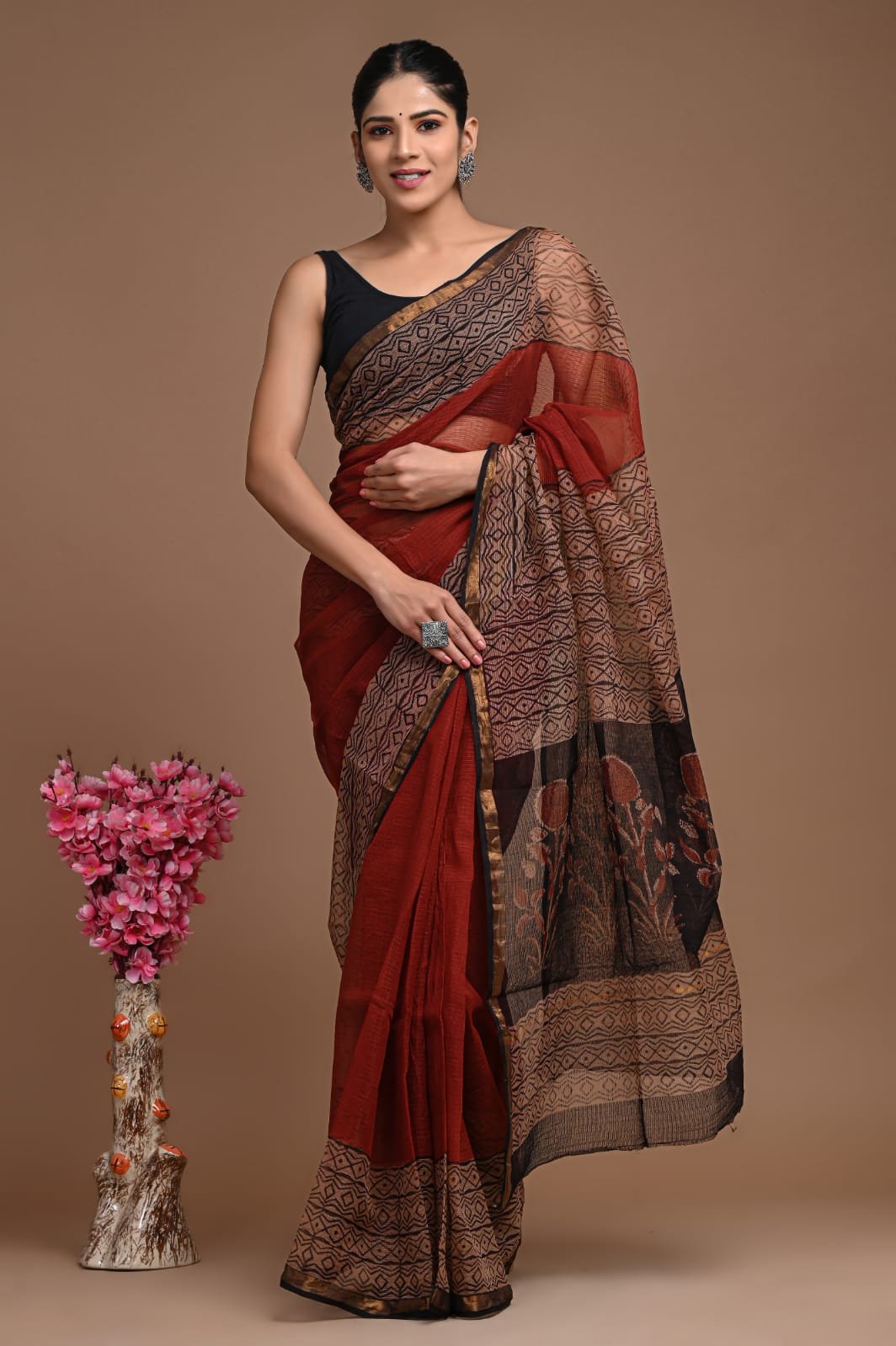 Brick red saree with geometric and floral Bagru prints