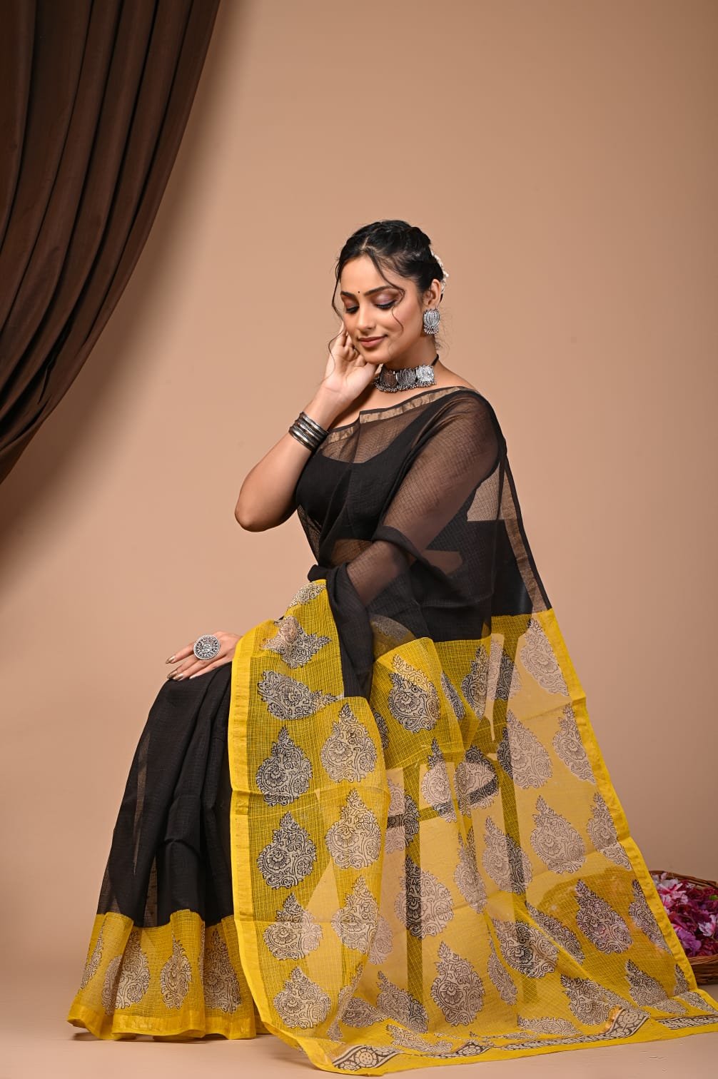 Yellow and black Kota Doriya saree with buta motifs and a traditional border