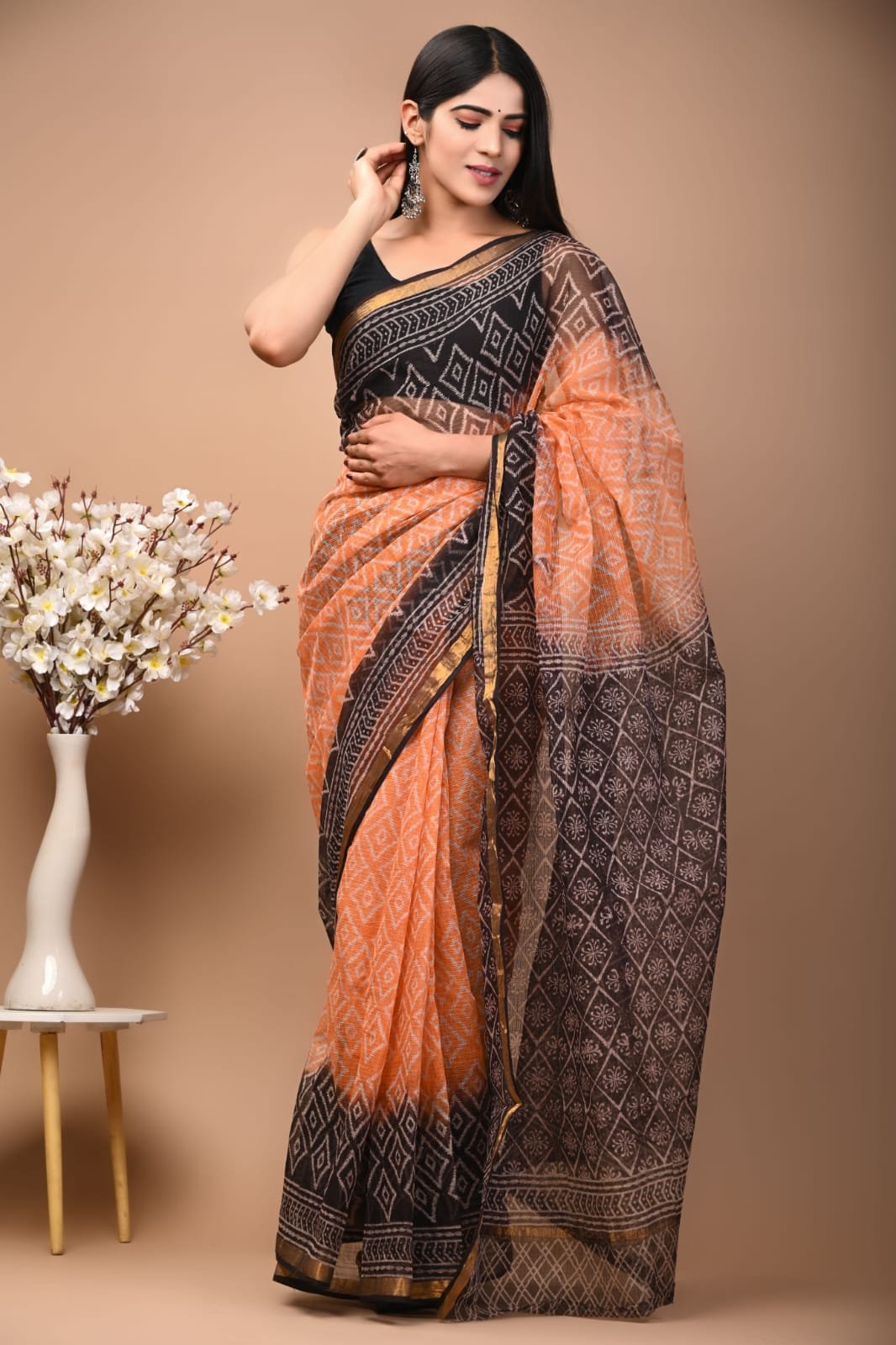 Orange and black geometric patterned Kota Doriya Silk saree with Bagru print design