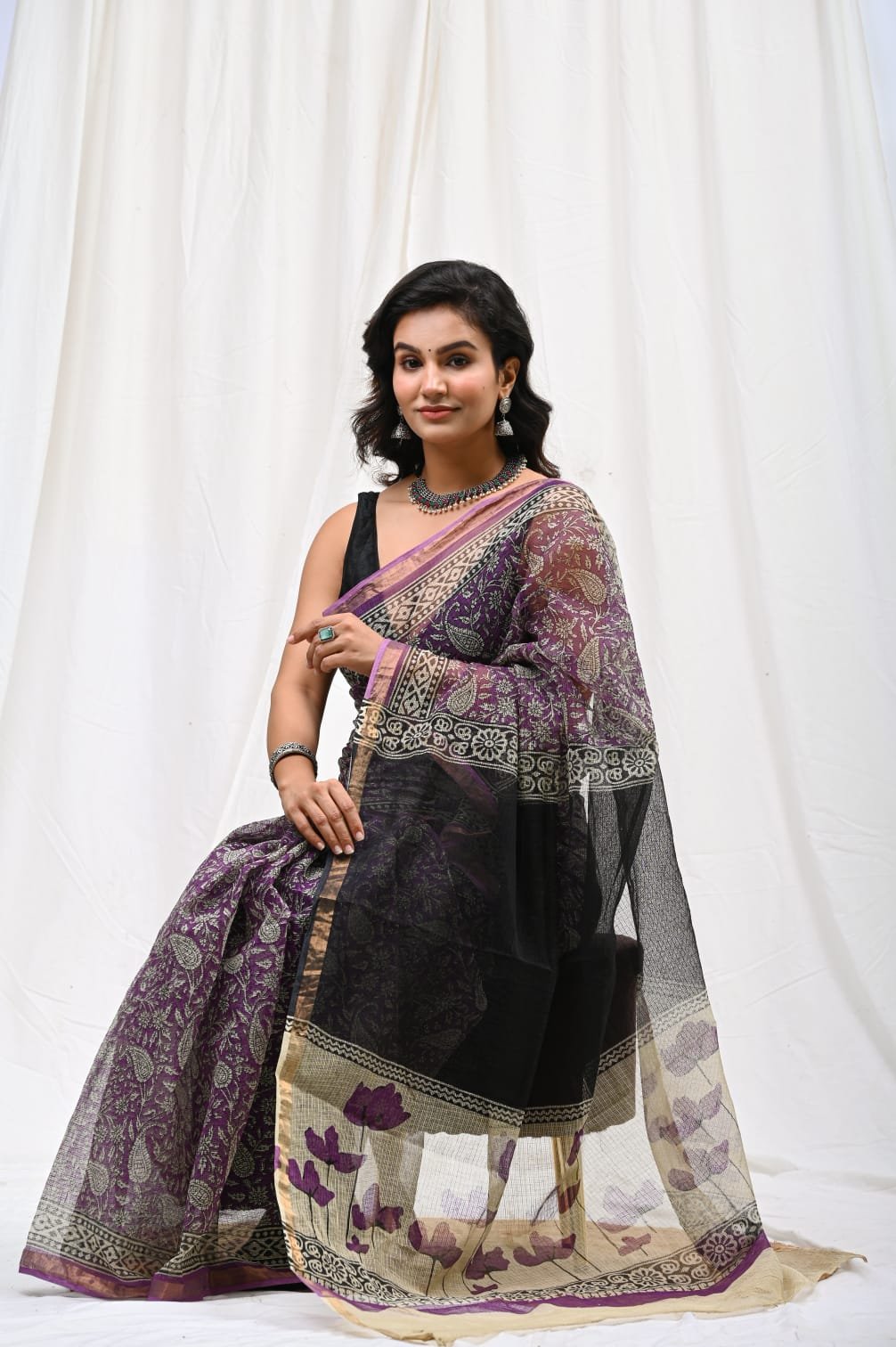 Purple saree with floral motifs and contrasting border in Bagru print
