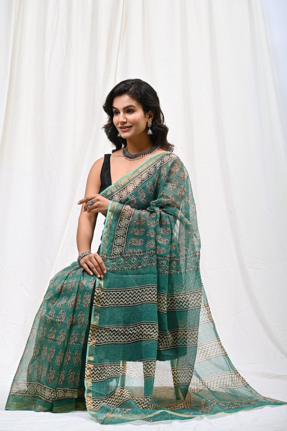 Teal saree with floral Bagru hand block print motif and khat texture