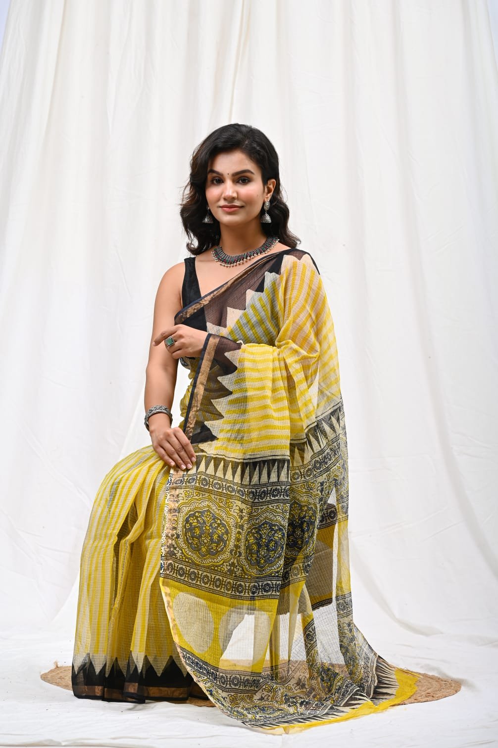 Yellow and black Kota Doriya saree with geometric and jaal motifs