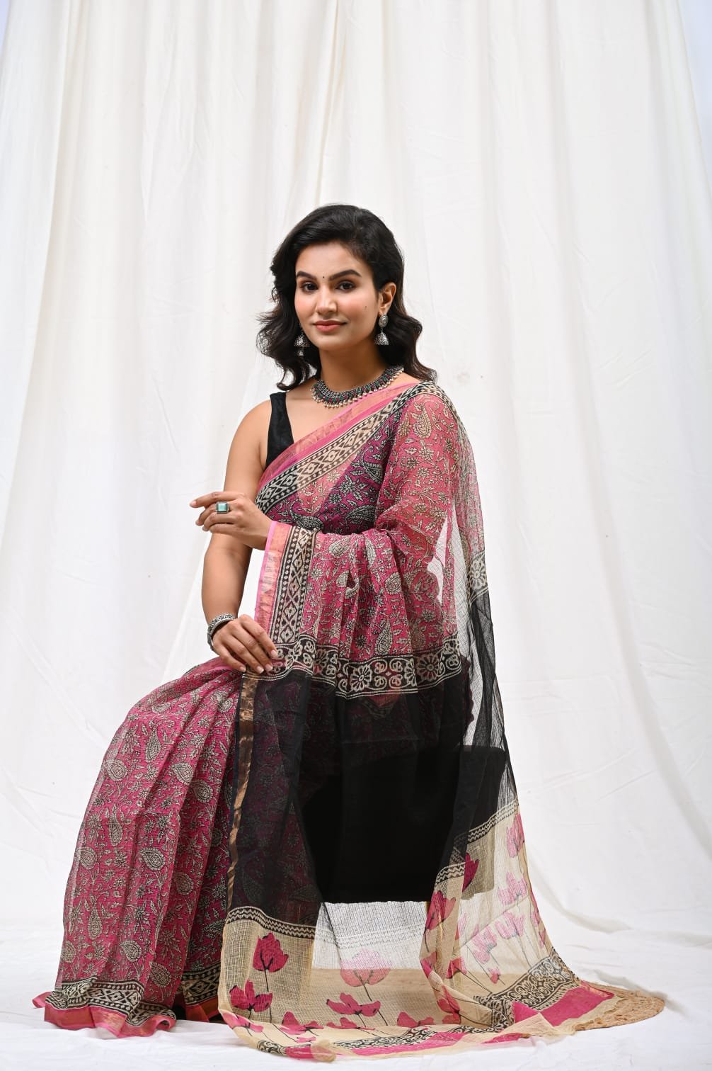 Black and pink Kota Doriya silk saree with floral motifs and border design