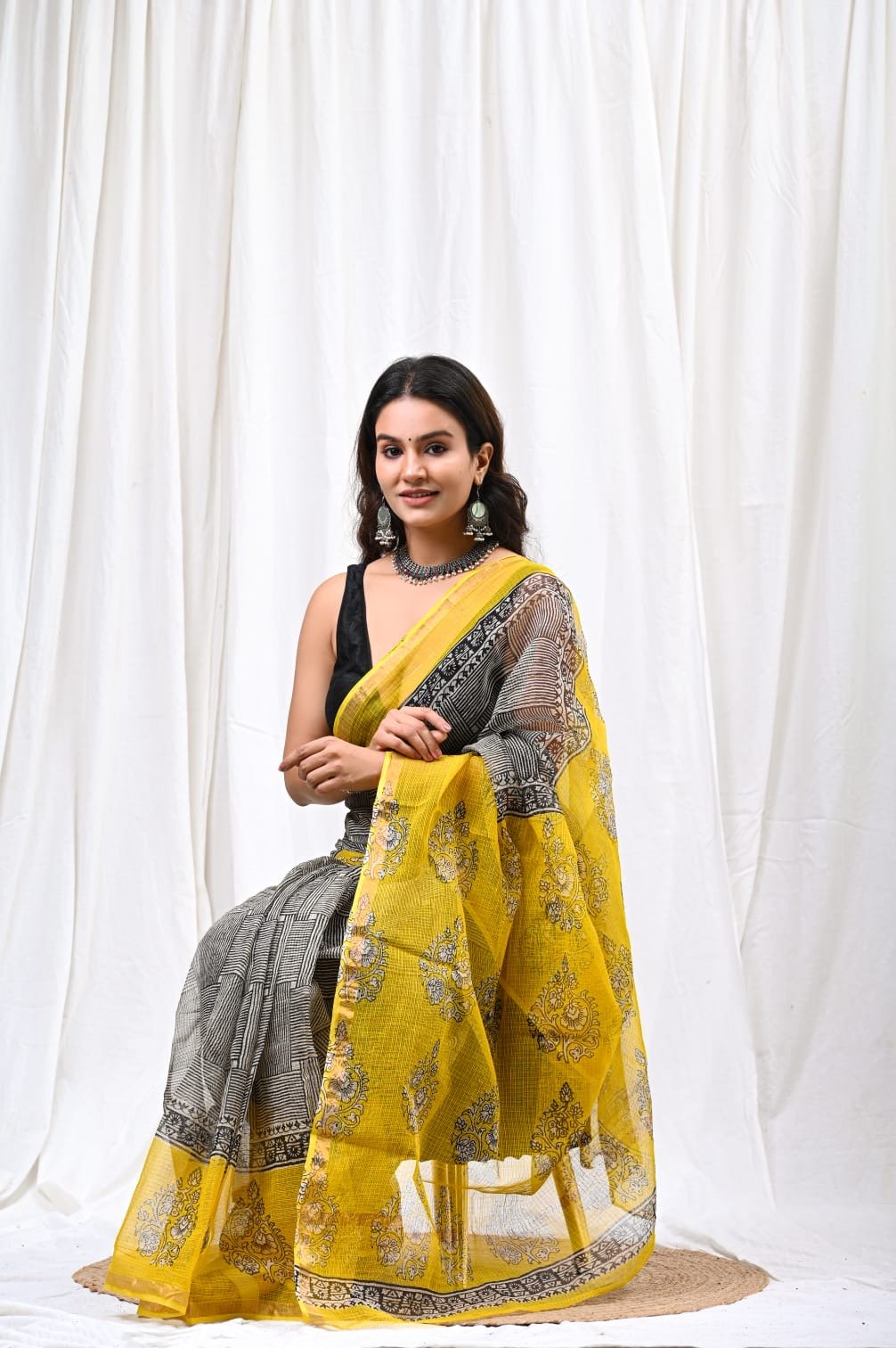 Yellow Kota Doriya saree with floral Bagru hand block print design