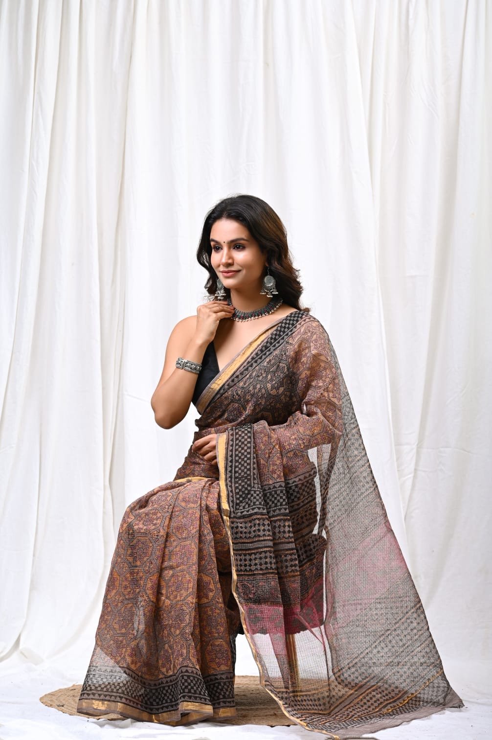 Saree featuring earthy tones with geometric Bagru hand block prints and Kota Doriya khat texture.