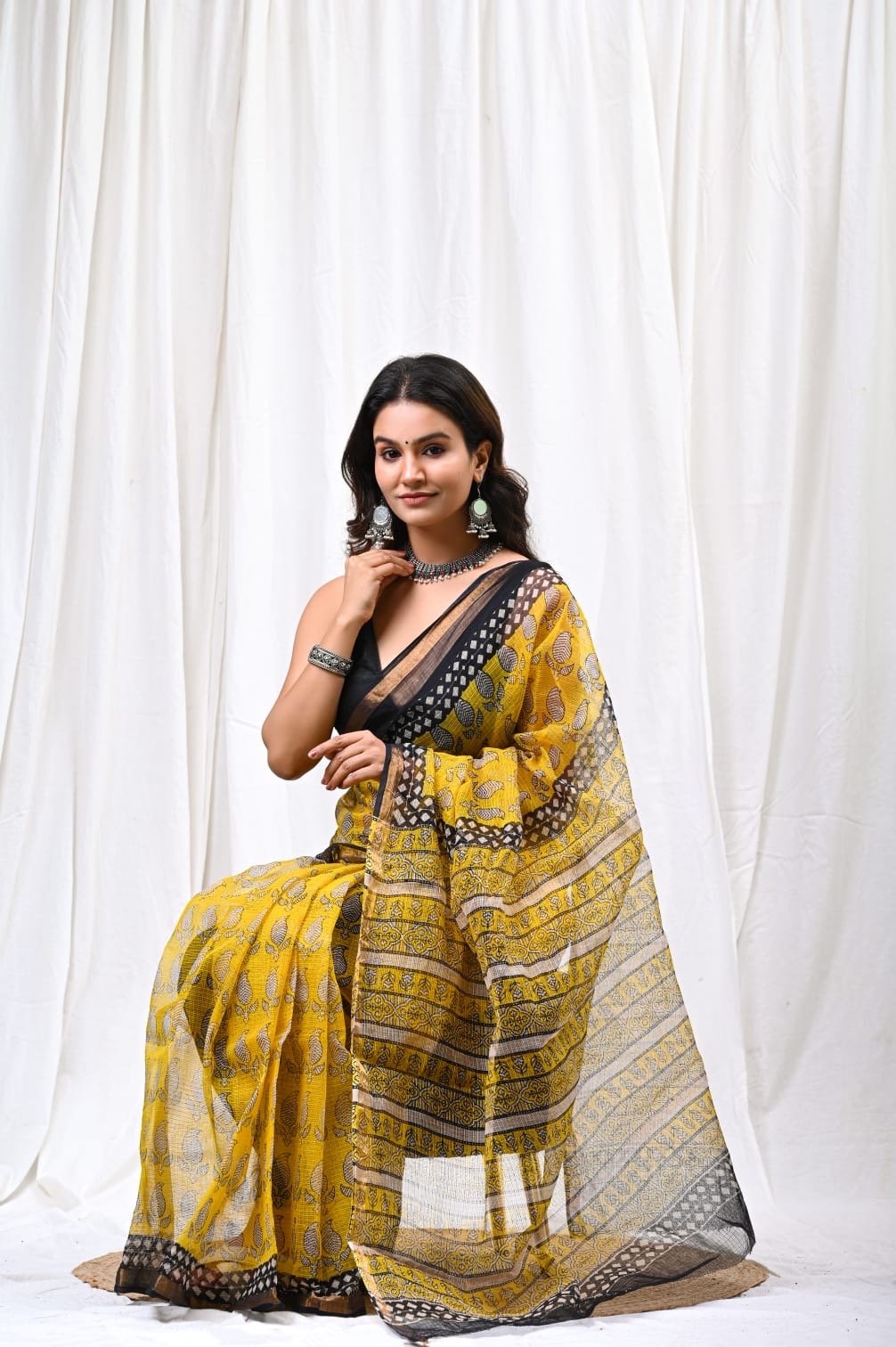 Vibrant yellow saree with floral motifs and Bagru hand block print