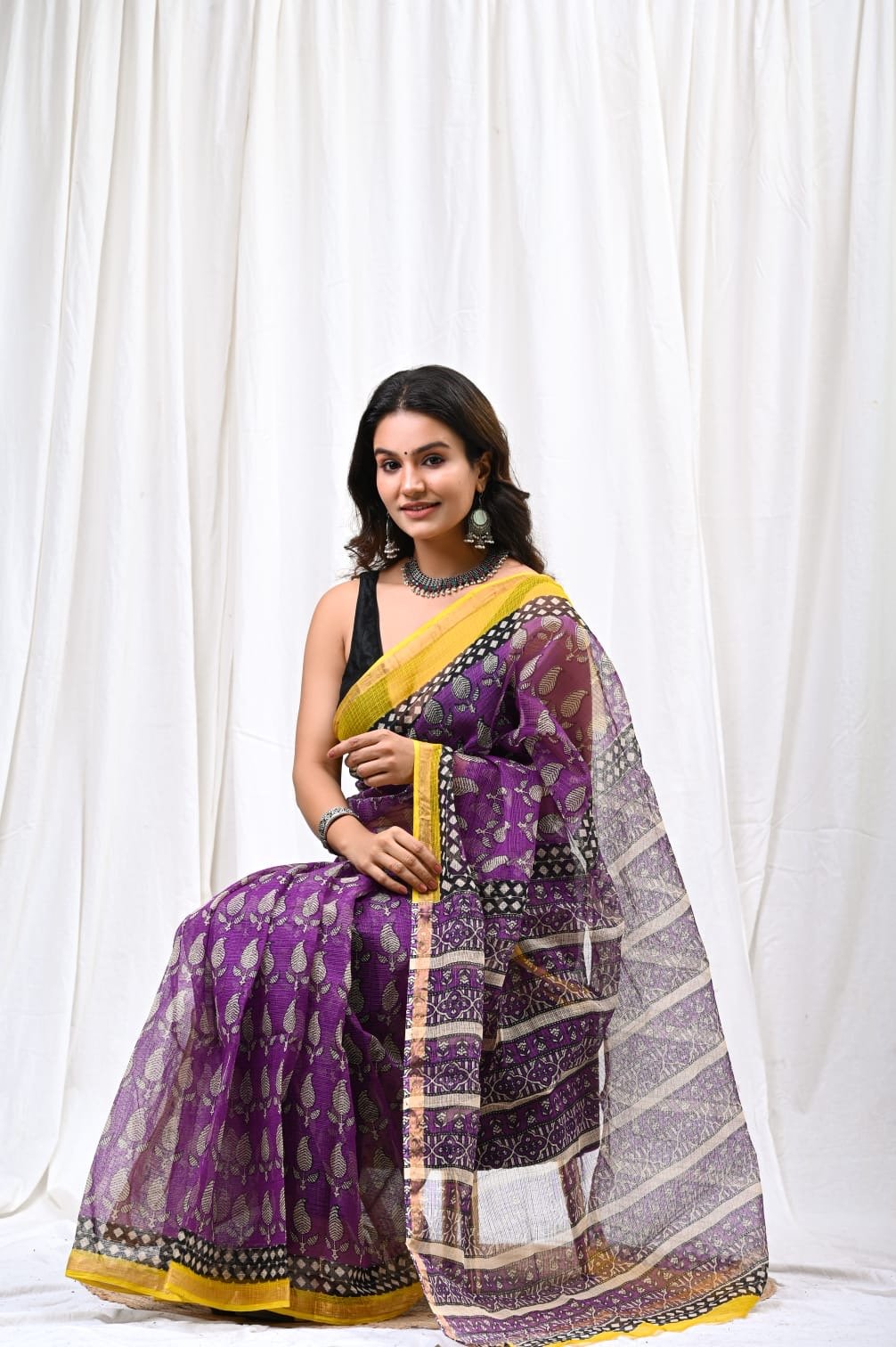 Purple saree with floral Bagru print and yellow border design