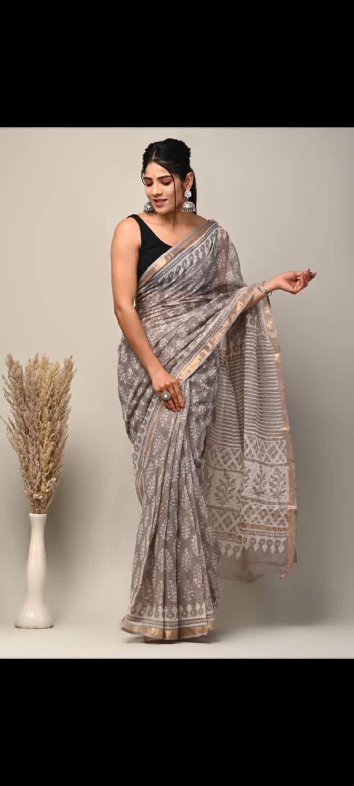 Grey Kota Doriya saree with floral Bagru hand block prints and intricate border patterns.