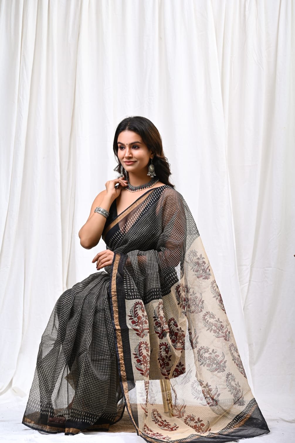 Black and beige Kota Doriya saree with floral motifs and khat texture