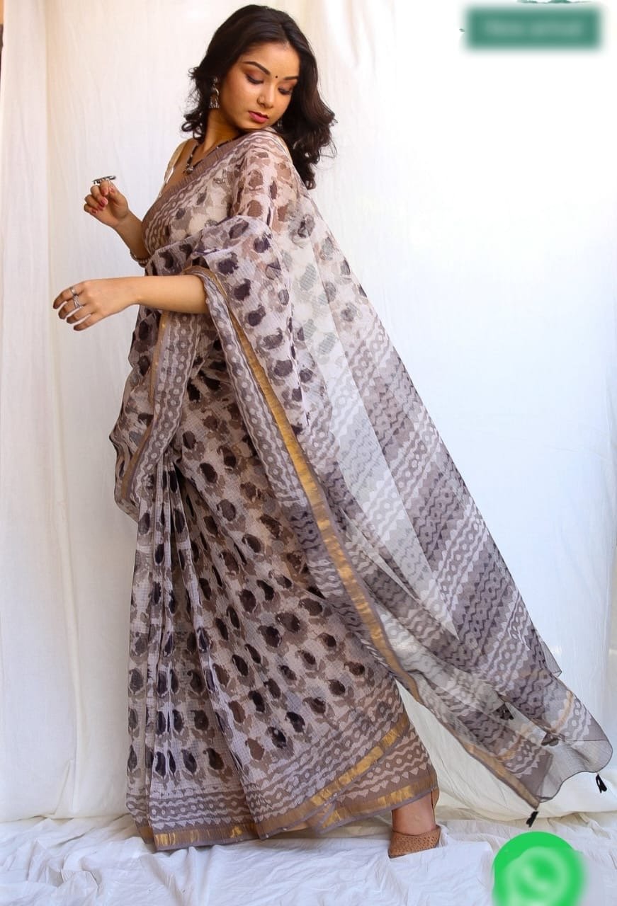 Saree with earthy brown tones, floral motifs, golden border design