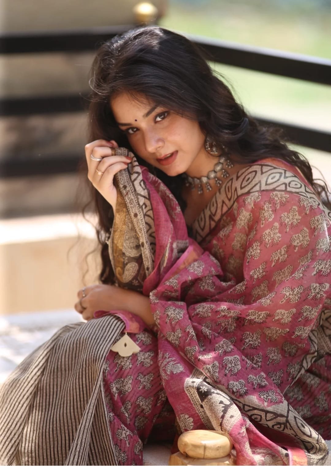 Pink Kota Doriya saree with floral motifs and geometric border design