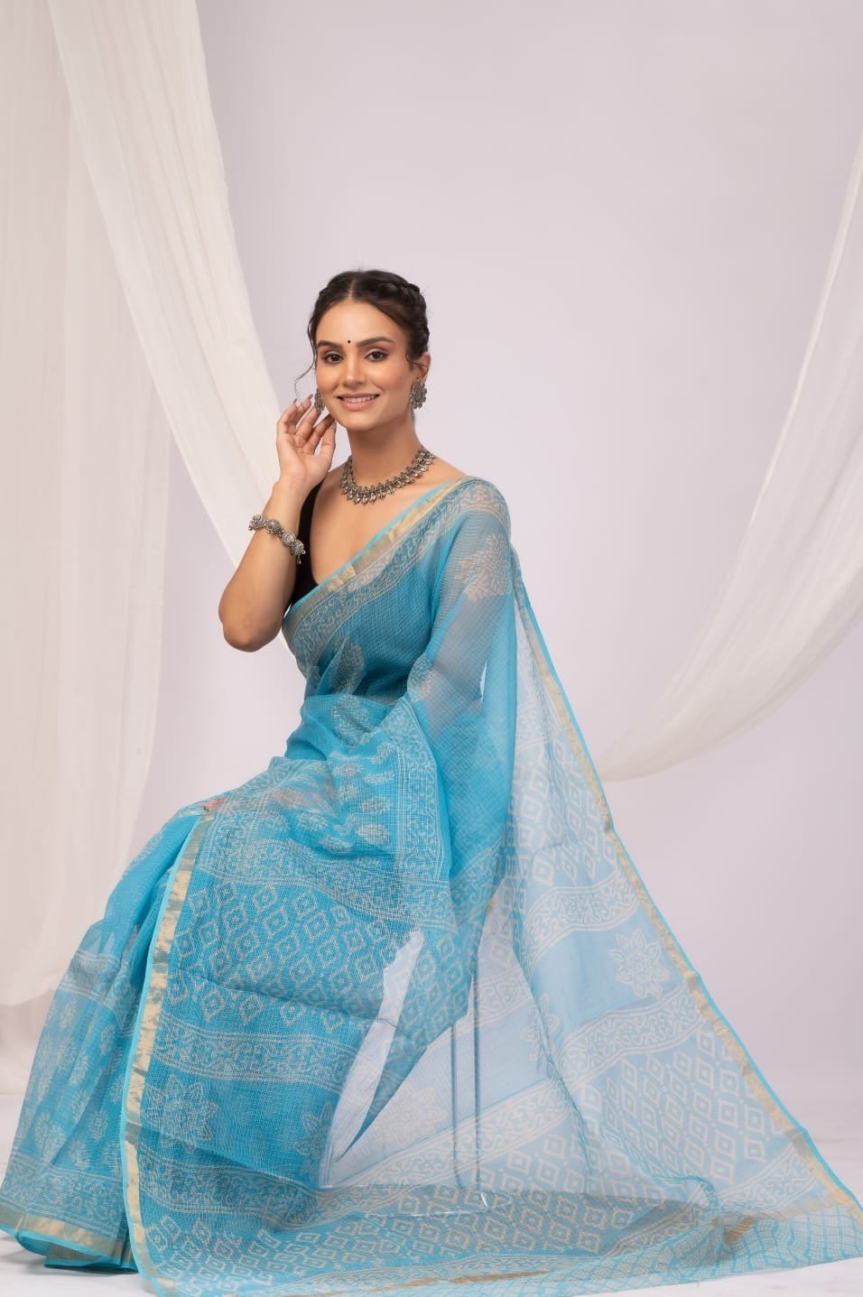 Sky blue saree with floral Bagru hand block print and gold border