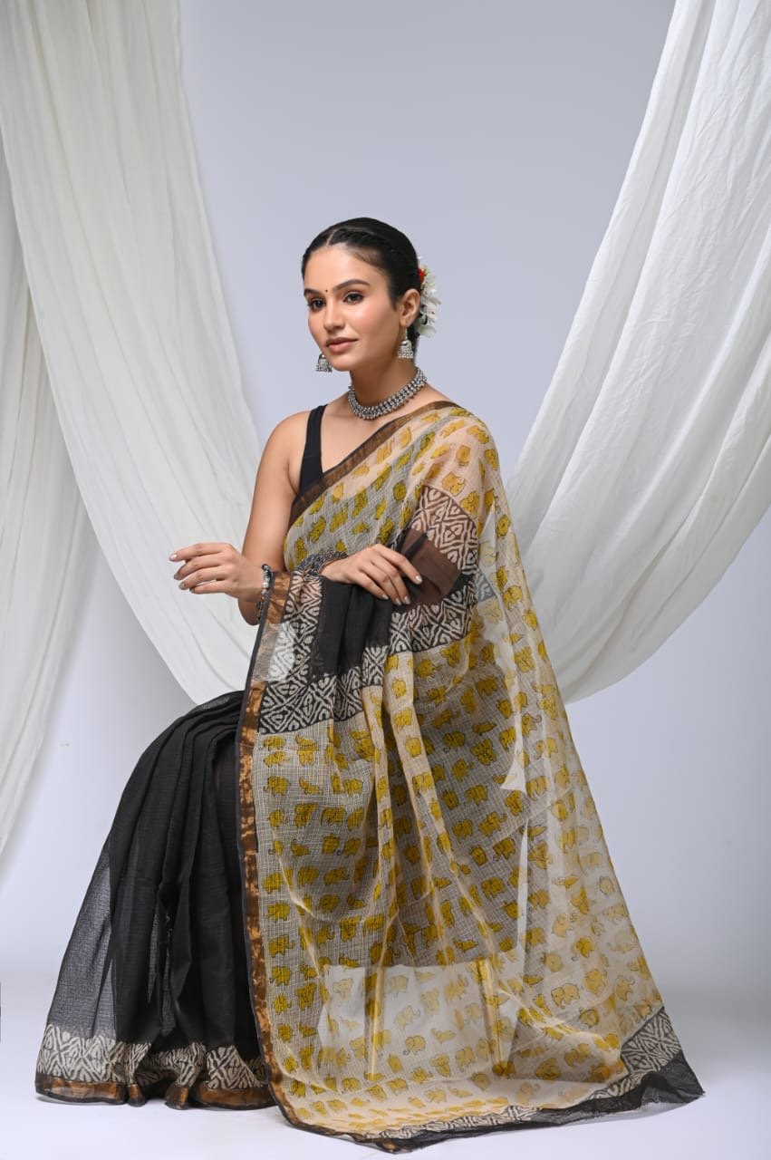 Yellow and black Kota Doriya silk saree with elephant motifs and geometric border