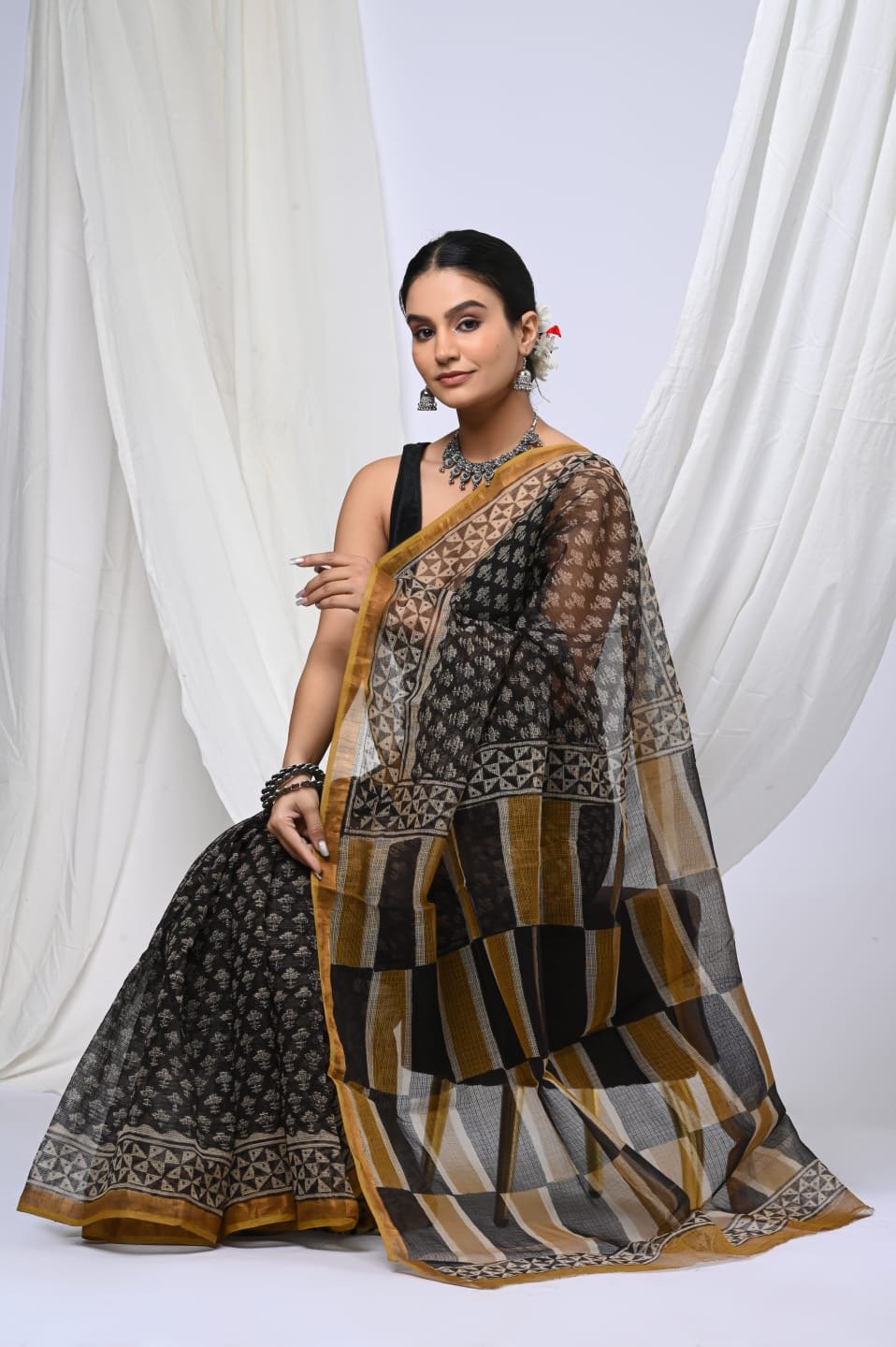 Black and mustard saree with geometric Bagru hand block print and distinctive khat texture
