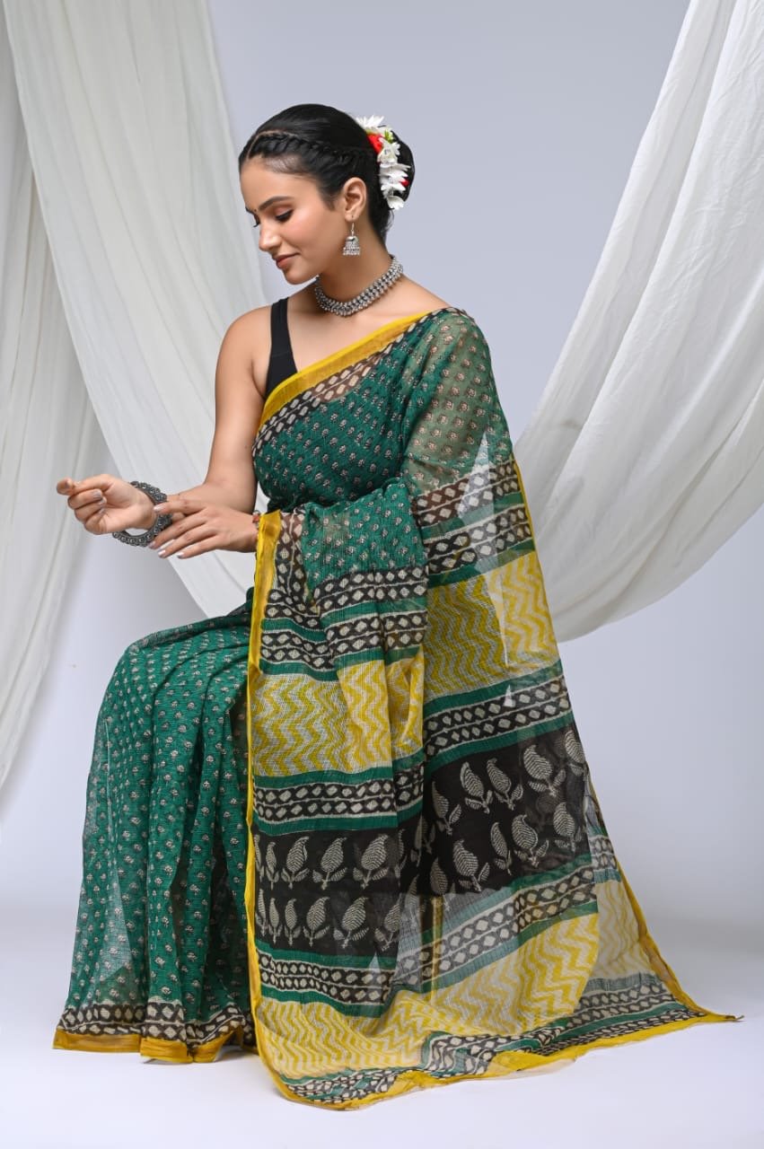 Green and yellow Kota Doriya silk saree with floral prints and geometric patterns