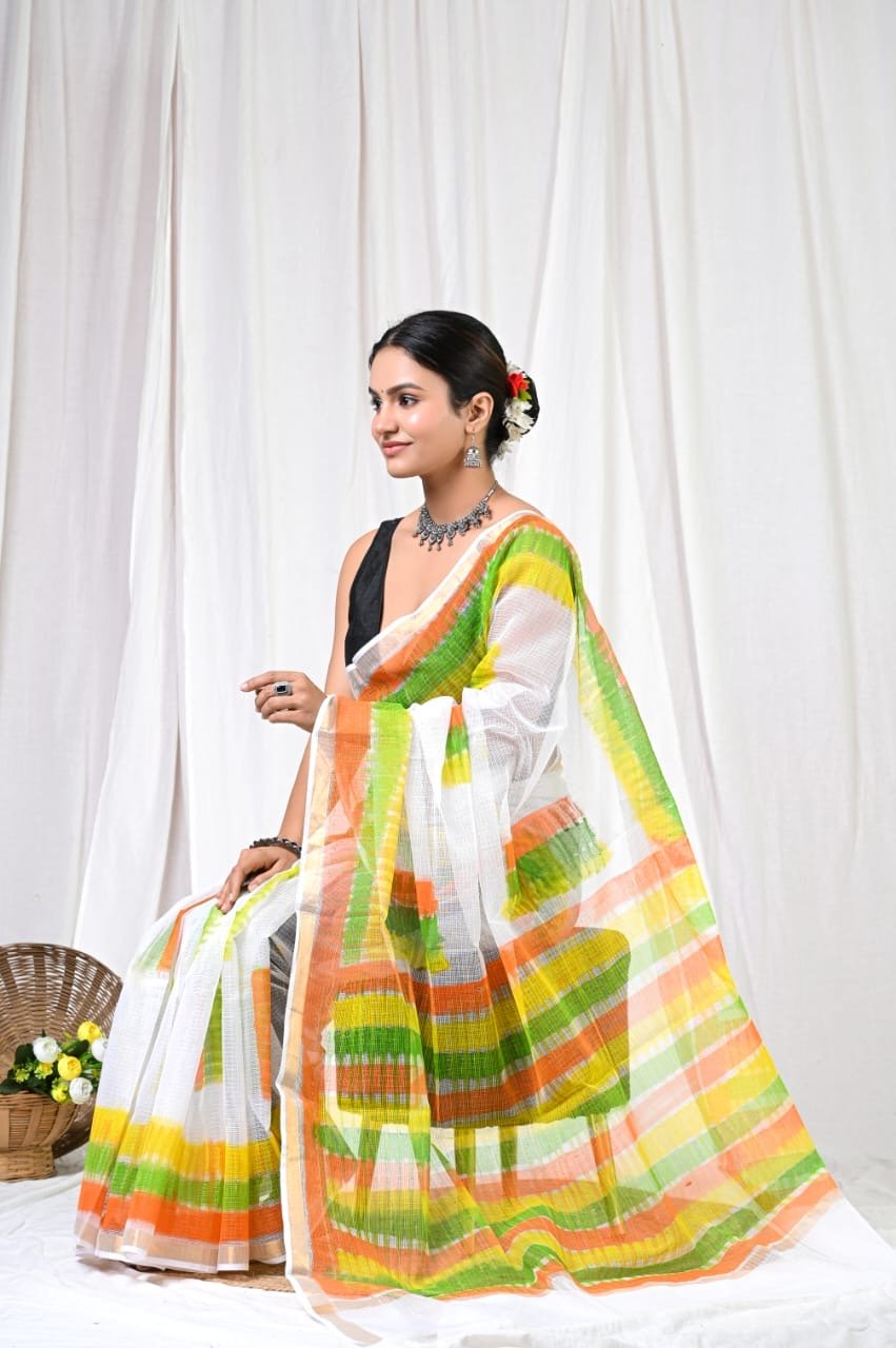 White saree with vibrant orange, green, yellow stripes and khat texture